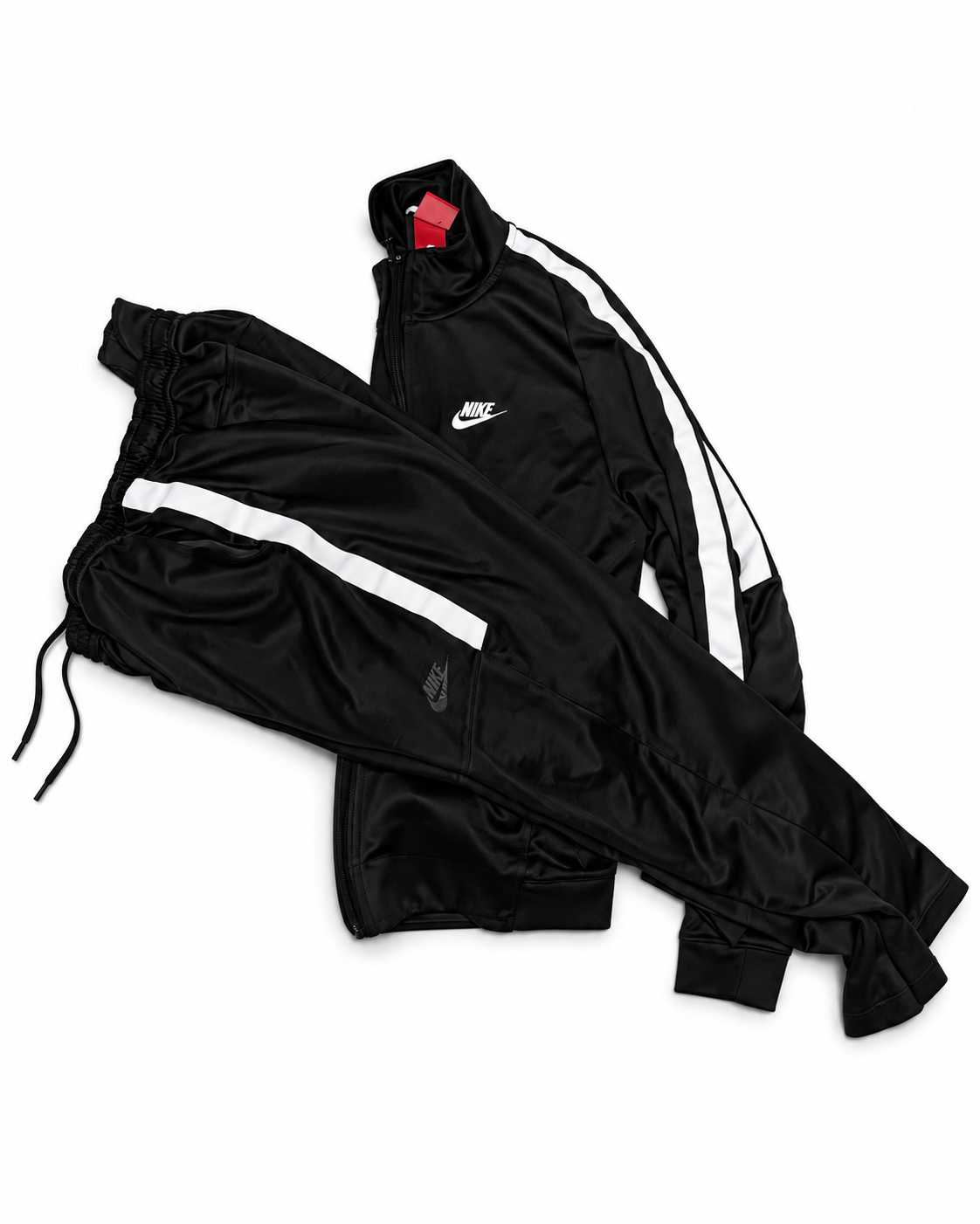 Conjunto de chaqueta y pantalón deportivos Nike en blanco y negro – Usado